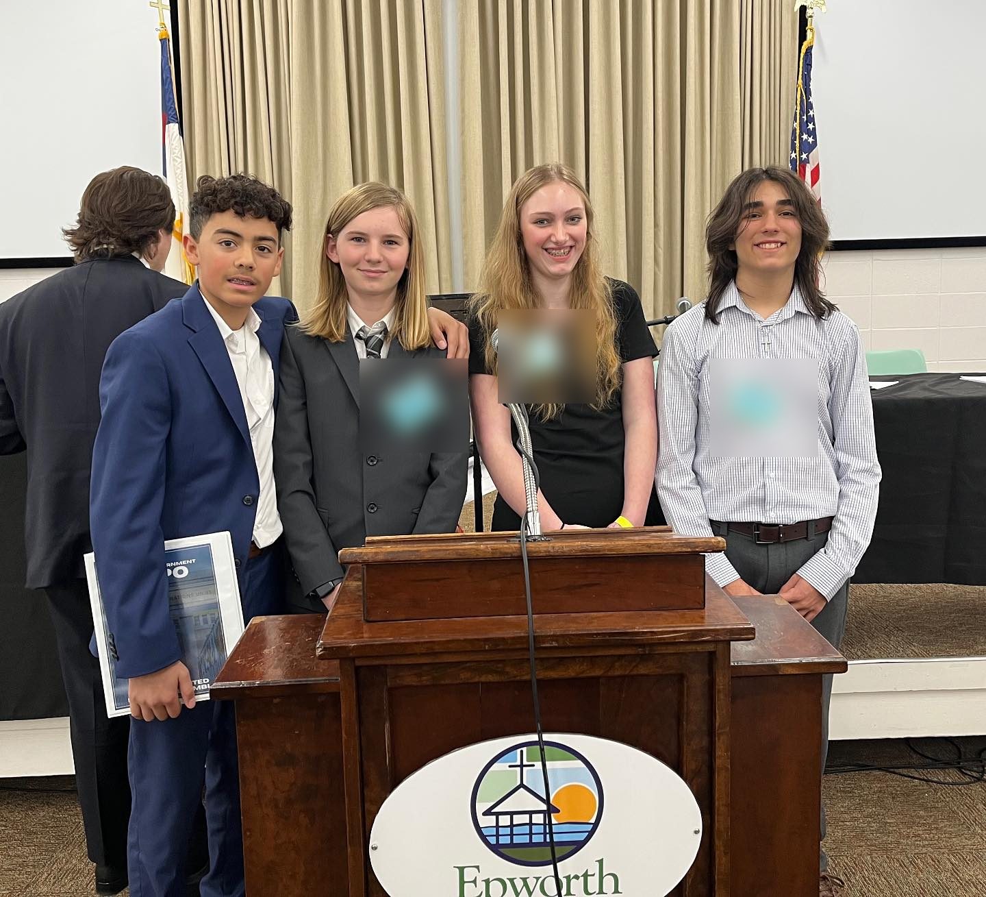 AIA Middle School students dressed professionally at a youth Model United Nations assembly