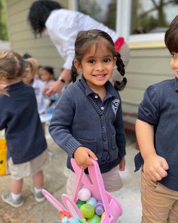 Children searching the lawn during the Spring Festival egg hunt